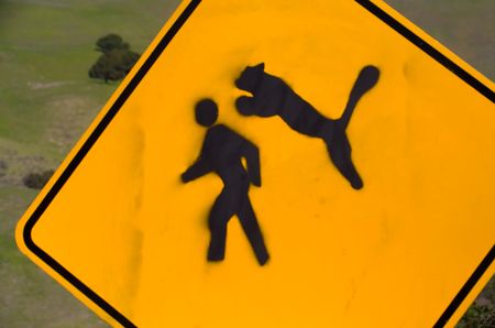 Sign warning of mountain lion attacks in areaの写真素材