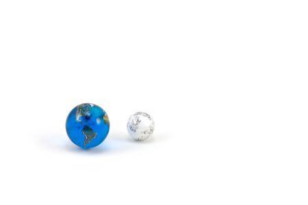 Earth and Moon Marbles isolated on White Backgroundの写真素材