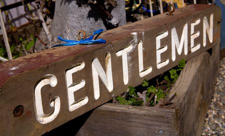 Old, Weathered Sign with the Word Gentlemenの写真素材