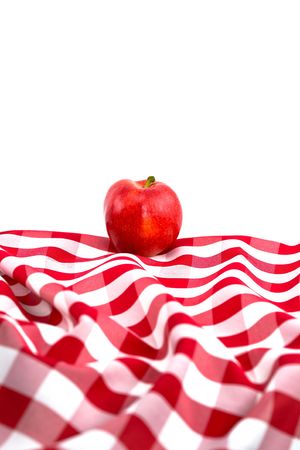 Red Gala Apple on Checkered Tablecloth on White Backgroundの写真素材