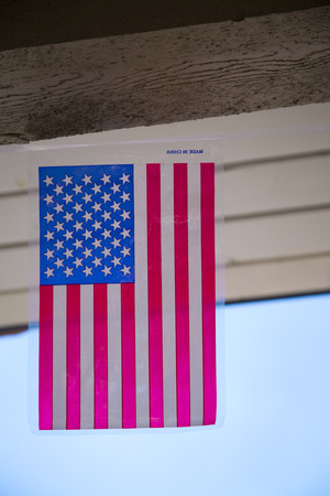 Plastic american flag hanging. Text reads のeditorial素材