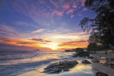 Beautiful view of a beach in Sungai Batu Penang during sunsetの写真素材