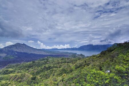 Wide nature shot of Mount Batur which is also one of volcano in Bali, Indonesia.の写真素材