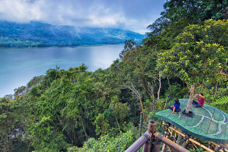 Beautiful nature view of Buyan Lake with man made leaf shape platform for tourist to photograph their memories here in Baliのeditorial素材