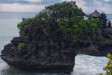 Close up view of Pura Batu Bolong on top a cliff in Tanah Lot, Bali. Uneven horizontal line and tigh composition due to get a nice output of the templeのeditorial素材