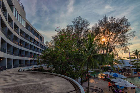 Penang, Malaysia-Mac 31st,2018:Magnificent view from a hotel during sunset with a lot of visitors hanging at the swimming pool area.Penang has plenty of good hotels for tourist.のeditorial素材