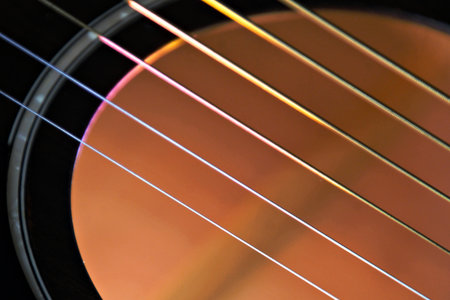 Detail of the strings of an acoustic guitar, close-up