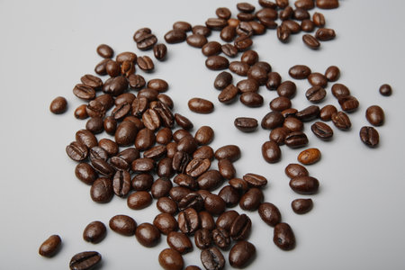 close-up of brown coffee beans in a bowl, coffee beans background, coffee beans in a bowl on wooden...