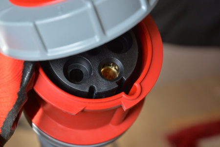 Blue plastic professional power connector. High voltage power electric cable. Industrial power plug...