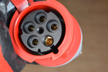 Blue plastic professional power connector. High voltage power electric cable. Industrial power plug...