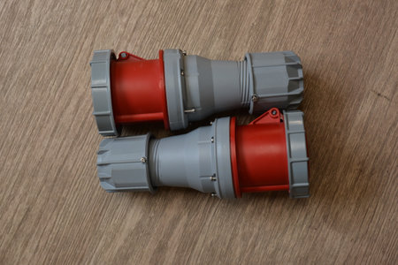 Blue plastic professional power connector. High voltage power electric cable. Industrial power plug...