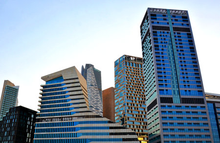Modern buildings in the Al Olaya downtown district in a sunset sky Al Riyadh, Saudi Arabia. High...