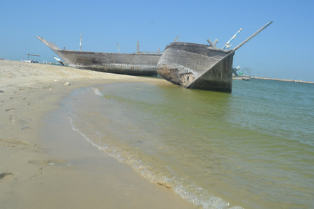 An old, broken boat looks out to sea. Foggy future.