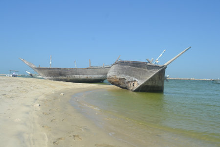 An old, broken boat looks out to sea. Foggy future.