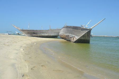 An old, broken boat looks out to sea. Foggy future.