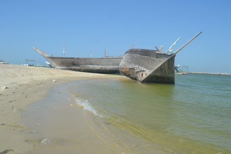 An old, broken boat looks out to sea. Foggy future.