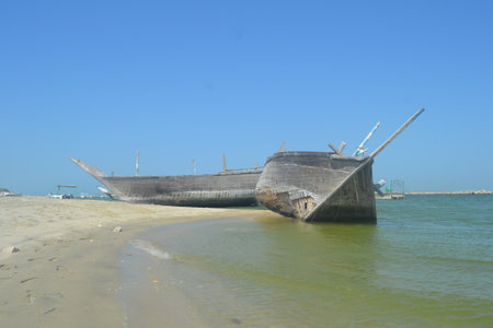 An old, broken boat looks out to sea. Foggy future.