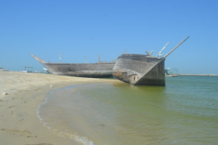 An old, broken boat looks out to sea. Foggy future.