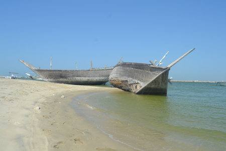 An old, broken boat looks out to sea. Foggy future.