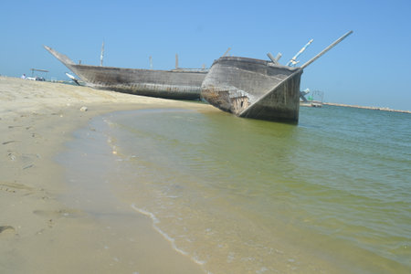 An old, broken boat looks out to sea. Foggy future.