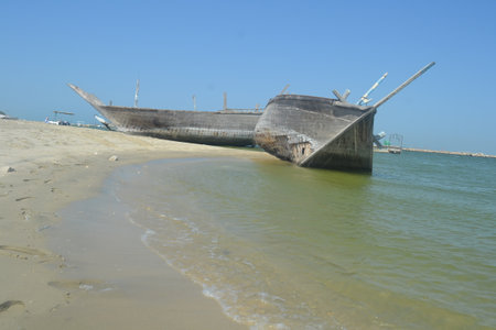 An old, broken boat looks out to sea. Foggy future.