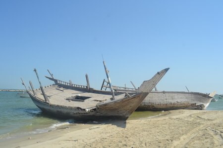 An old, broken boat looks out to sea. Foggy future.