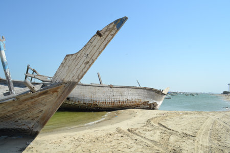 Detail and closeup of old and colored boat wooden hull,