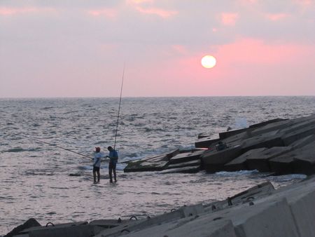 Fishing at sunsetの写真素材