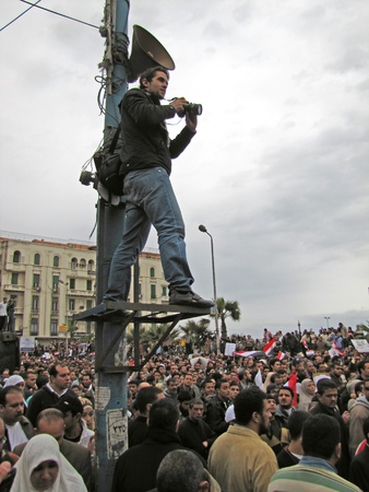 Alexandria, Egypt - February 4, 2011 - Amateur photographer photographing Egyptian demonstrators                          のeditorial素材