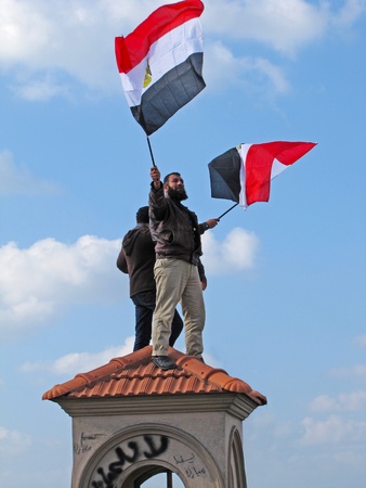 Alexandria, Egypt - February 11, 2011 - Egyptians demonstrators waving flags                               のeditorial素材