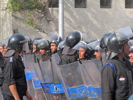 Alexandria, Egypt - Janruary 28, 2011 - Egyptian police force facing demonstrators                               のeditorial素材