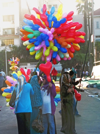 Alexandria, Egypt - November 15, 2010 - Women buying baloons on feast morning					のeditorial素材