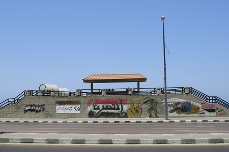 Alexandria, Egypt - July 12, 2011 - the Egyptian revolution inspired Egyptian graffiti artists. Translation of Arabic text celebrating victory:  "The people and the army....serving Egypt", "Egypt is free"のeditorial素材