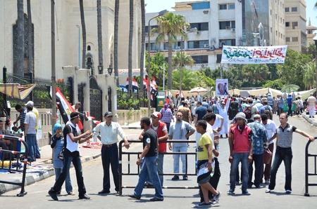 Alexandria, Egypt - July 15, 2011 -Community check point. Citizens organizing security check points to protect protesters during demonstrations calling for the trial of Mubarak and his regime.のeditorial素材