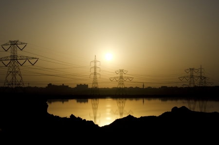 Electric Power Distribution Towers at Sunsetの写真素材