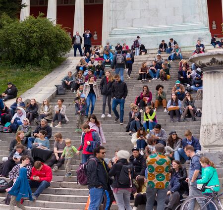 theresienwiese, munich, germany, 2019 april 27: people taking a brake at a Jumble sale, flea market in bavaria at the theresienwiese in munichのeditorial素材