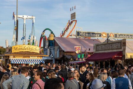 Munich, Germany - 2019 September 29: visitors, beertents and candy shops on the oktoberfest in munichのeditorial素材