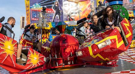 Munich, Germany, 2019 September 28: Visitors enjoy on an Amusement Park Ride. Breakdancer fun Ride,...