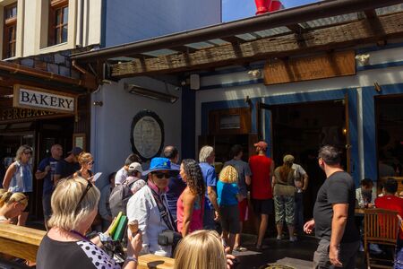 2016, February 14 - Queenstown, New Zealand, People in a queue waiting for the Fergburger the most...
