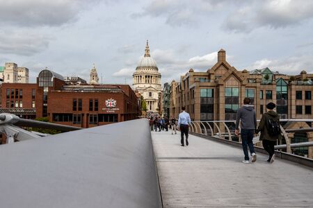 London, England - September 18, 2018: tourist walking from the Millennium Bridge to Saint Paul's...