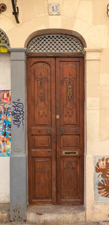 old brown wooden door in the old center city of Palma, Mallorcaの写真素材