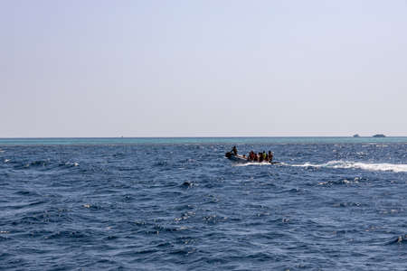 Hurghada, Egypt - september 17, 2019: Unknown people on a dinghy watching dolphins in the Red sea, Jaz ir Jift nのeditorial素材
