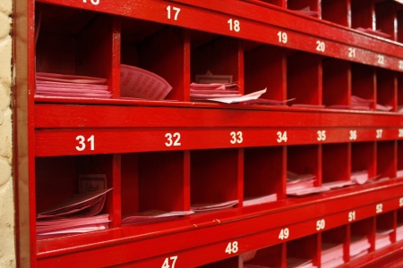 Red cabinet for fortunetelling with paper insideの写真素材