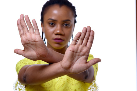Young African American woman showing two hands stop gesture against white backgroundの写真素材