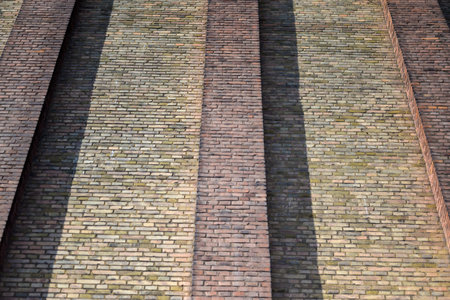 House wall made of different colored bricks in low angelの写真素材