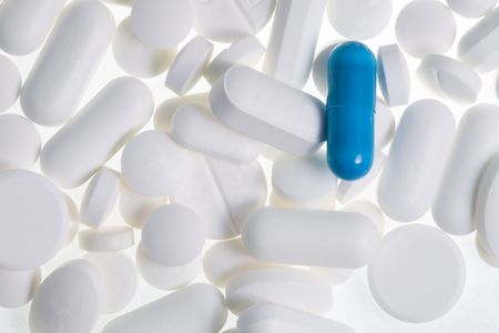 Various pills and capsules, one normal weekly dose of tablets for men of womanの写真素材