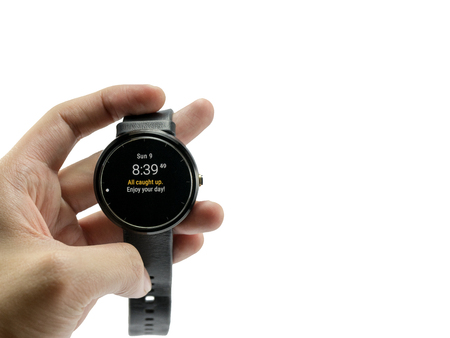 man hold smartwatch Leather watchbands black color circle front display digital time welcome message email on sunday morning eight  thirty-nine A.M.の写真素材