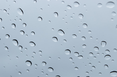 rain drop on glass view from carの写真素材