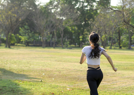 beautiful women nice figure running in parkの写真素材