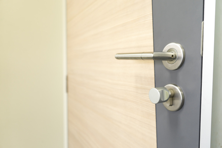 Door Handles stainless steel on door woodの写真素材